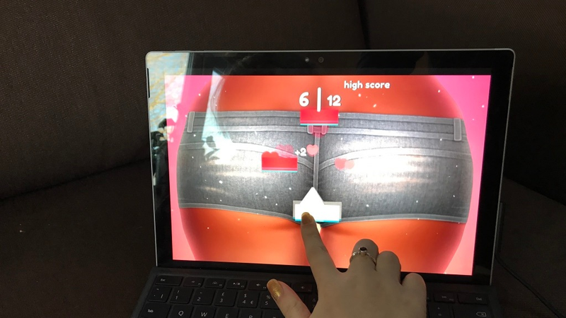 My own hand, seen here playing the rhythm game. What does that have to do with spanking? I don’t know.